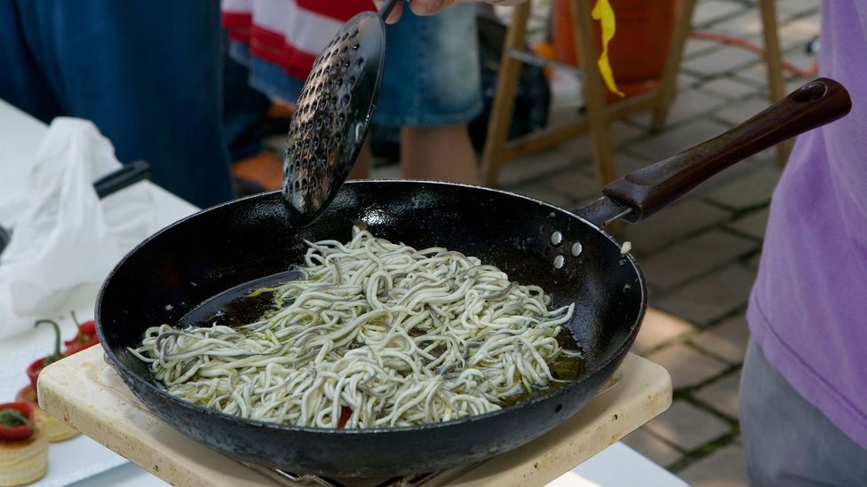 The traditional recipe for angulas a la bilbaína calls for tossing the eels with garlic and hot peppers fried in olive oil (Credit: Basque Country - Mark Baynes/Alamy)