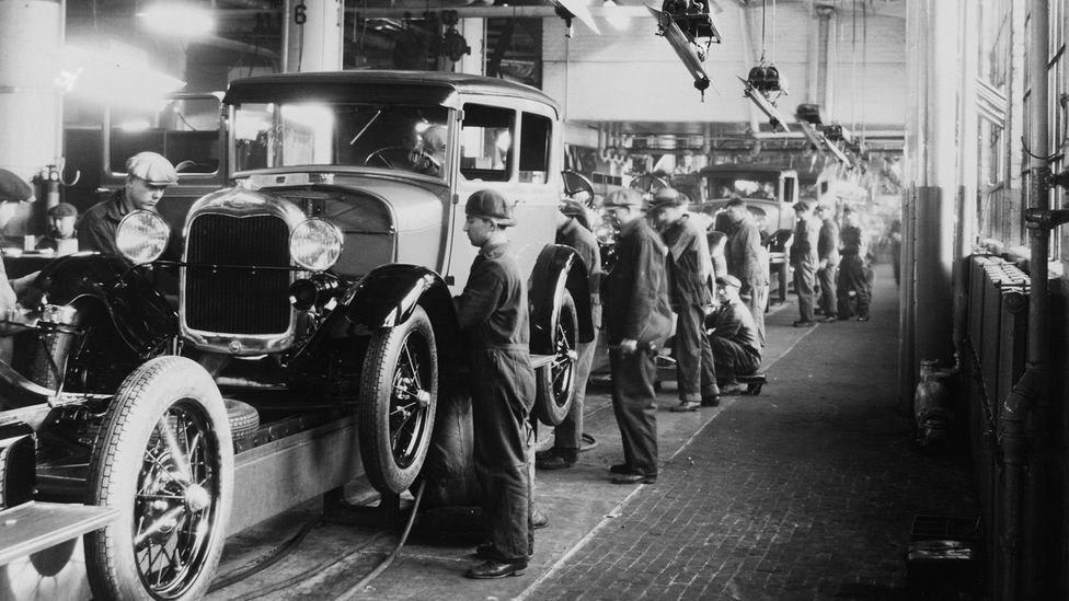 Assembly line workers inside the Ford Motor Company factory at Dearborn, Michigan (Credit: Getty Images)