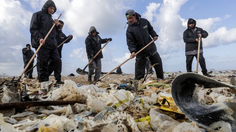 People cleaning beach (Credit: Getty Images)