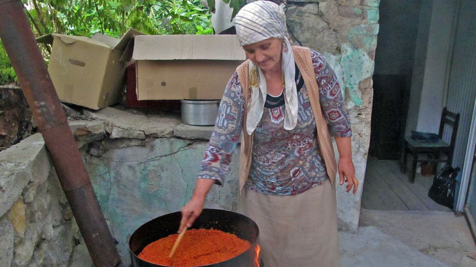 In Skopje, Macedonia, Mutic helped two women prepare <i>ajvar</i> (red pepper relish) while they shared their thoughts on Yugoslavia (Credit: Anja Mutic)