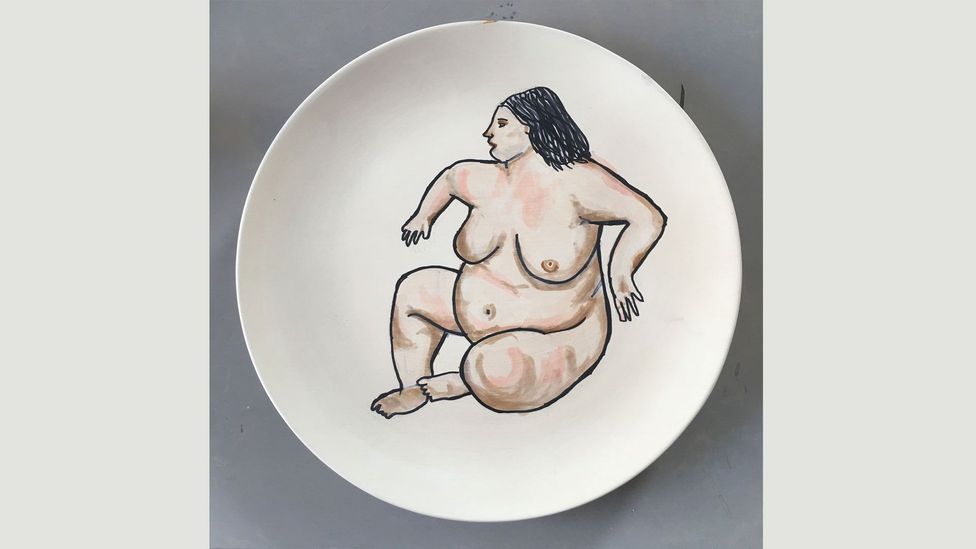 Tilley describes this image she painted on a plate as The Benefit Supervisor Has Woken Up (Credit: Sue Tilley)