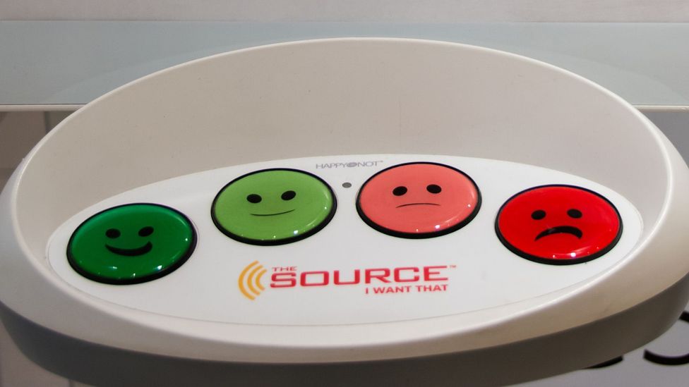 'Happy face' buttons like these are now commonly placed outside shops and businesses, and places like Heathrow Airport, to gauge customer happiness (Credit: Getty Images)