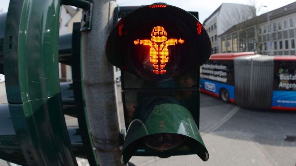 Traffic lights in the centre of Trier feature caricatures of Karl Marx (Credit: dpa picture alliance/Alamy)