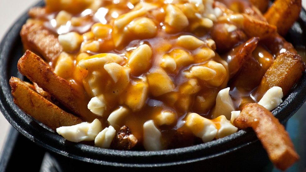In Québec, the origin of poutine – fries topped with gravy and cheese curd – is nearly as much a source of contention as that of the French fry itself (Credit: dbimages/Alamy)
