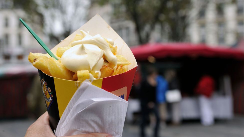 It’s only in Belgium that fries are truly a meal unto themselves, piled into a paper cone with a touch of mayonnaise (Credit: Richard Wareham Fotografie/Alamy)