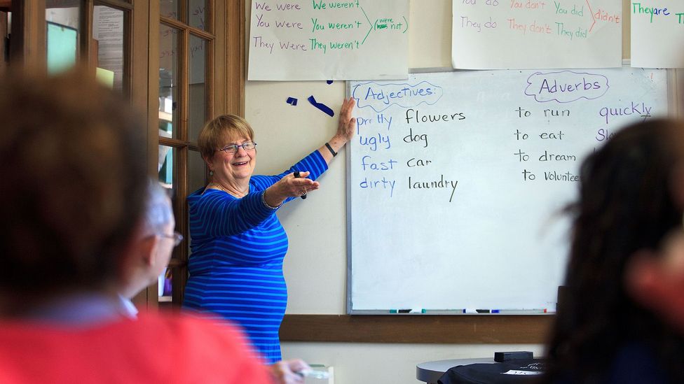 At a Massachusetts church, immigrants to the US sit in an English class (Credit: Getty Images)