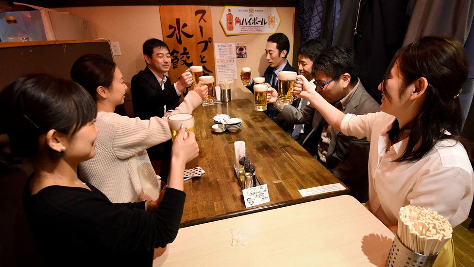 Workers in Tokyo knocking off at 3 p.m. on the last Friday of the month. It's a scheme called "Premium Fridays" that aims to improve work-life balance (Credit: Getty Images)