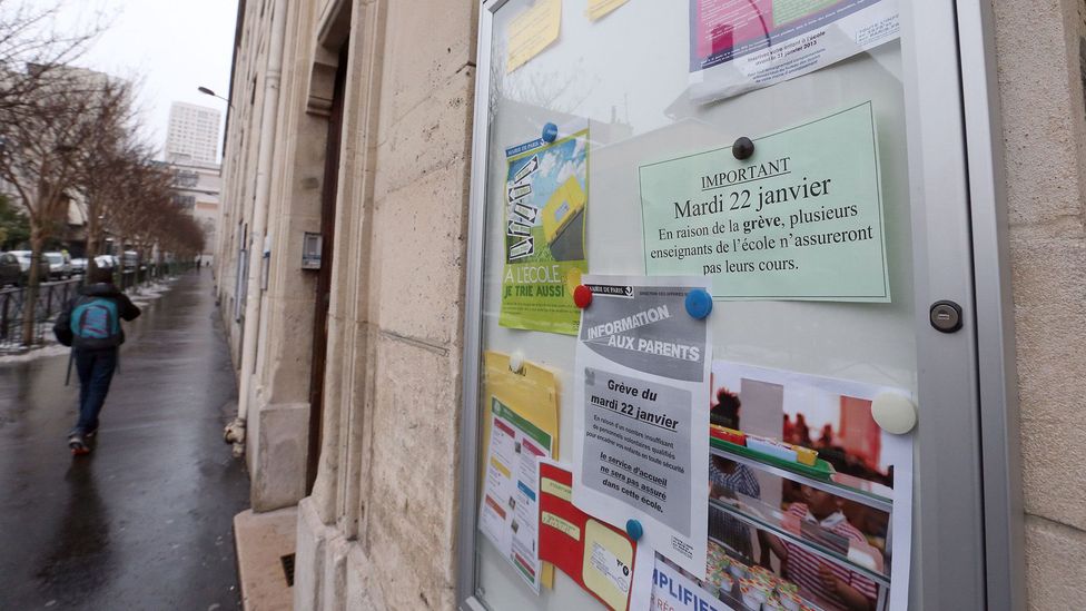 This 2013 image shows a sign at a primary school in Paris advocating for a 4.5-day school week (Credit: Getty Images)