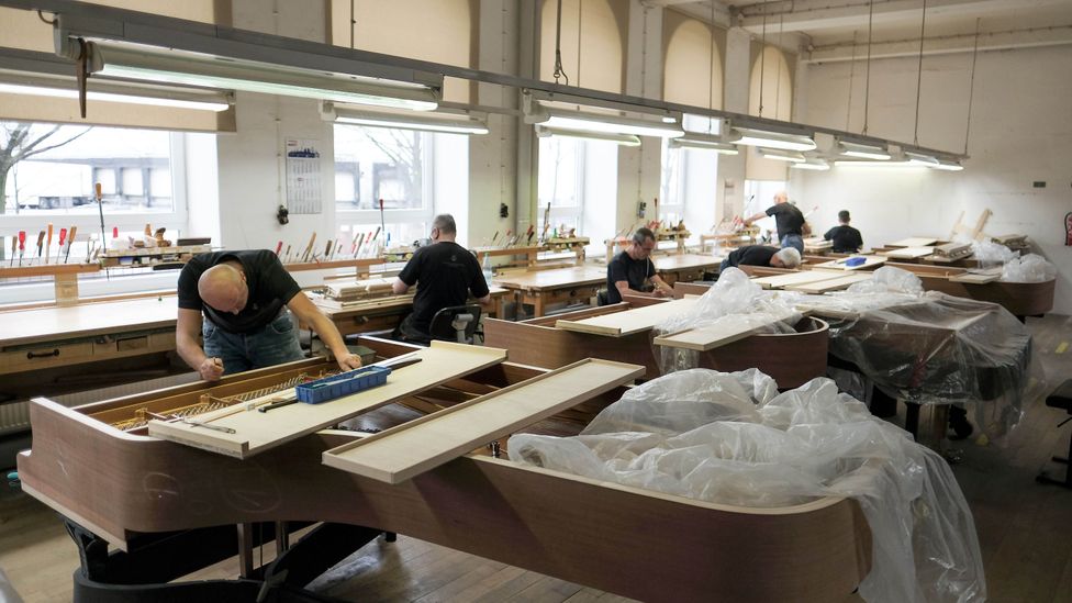 Technicians at piano manufacturer Steinway & Sons in Hamburg persevere with complex detailed work (Credit: Getty Images) Technicians at piano manufacturer Steinway & Sons in Hamburg persevere with complex detailed work (Credit: Getty Images)