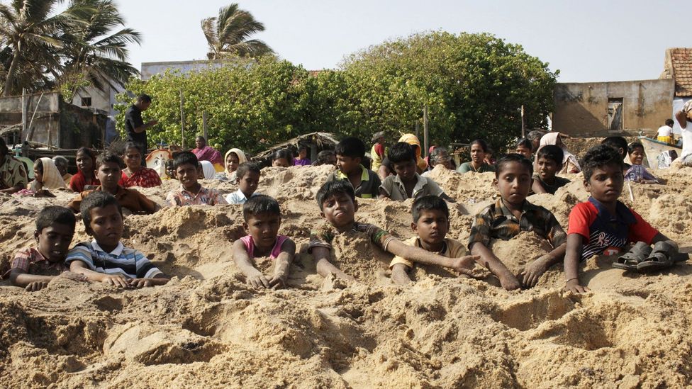 Activists from Tamil Nadu bury themselves to protest the loading of a uranium reactor. Yet the same sand holds thorium, a potentially safer nuclear power (Credit: Getty Images) Activists from Tamil Nadu bury themselves to protest the loading of a uranium reactor. Yet the same sand holds thorium, a potentially safer nuclear power (Credit: Getty Images)