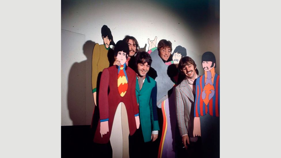 The Beatles posing with cardboard cut-outs of their Yellow Submarine characters in 1967 – its trippy visual style reflected the height of the psychedelic era (Credit: Getty)