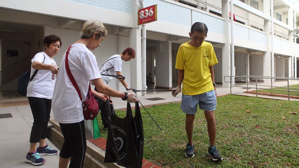 Volunteers at the Khatib clean up day although there are already 56,000 registered cleaners in Singapore (Credit: Tim McDonald) Volunteers at the Khatib clean up day although there are already 56,000 registered cleaners in Singapore (Credit: Tim McDonald)