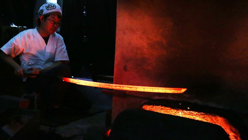 The tamahagane is heated and quenched many times as the swordsmith forges the blade (Credit: Getty Images) The tamahagane is heated and quenched many times as the swordsmith forges the blade (Credit: Getty Images)