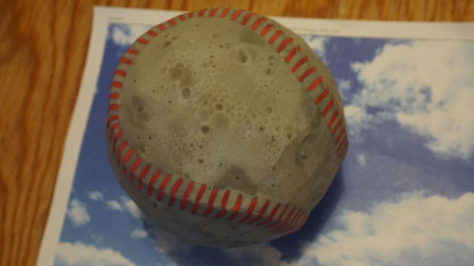 By subtly changing the texture of an object, researchers were able to make a 3D printed baseball look like an espresso (Credit: MIT)