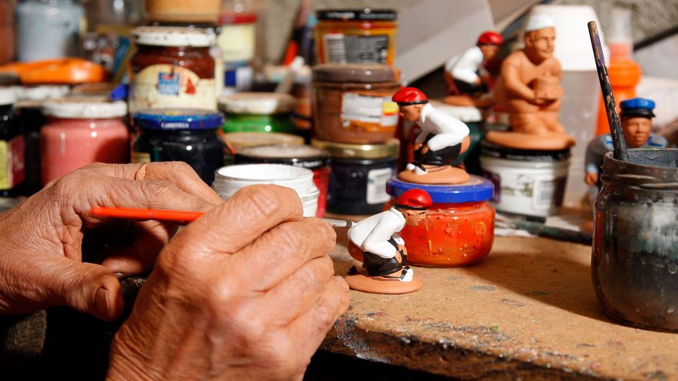 Catalans have a relaxed view of the caganer, seeing them as merely depicting a natural act as opposed to being uncouth (Credit: Miquel Benitez/Getty Images) Catalans have a relaxed view of the caganer, seeing them as merely depicting a natural act as opposed to being uncouth (Credit: Miquel Benitez/Getty Images)
