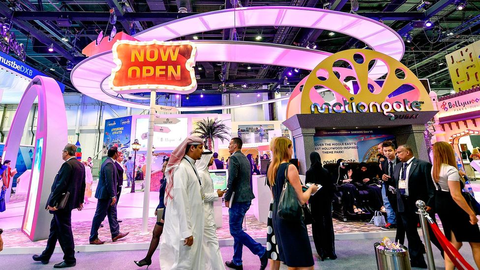 Visitors pass the Dubai Parks and Resorts stand during the Arabian Travel Market 2017 (Credit: Getty Images) Visitors pass the Dubai Parks and Resorts stand during the Arabian Travel Market 2017 (Credit: Getty Images)