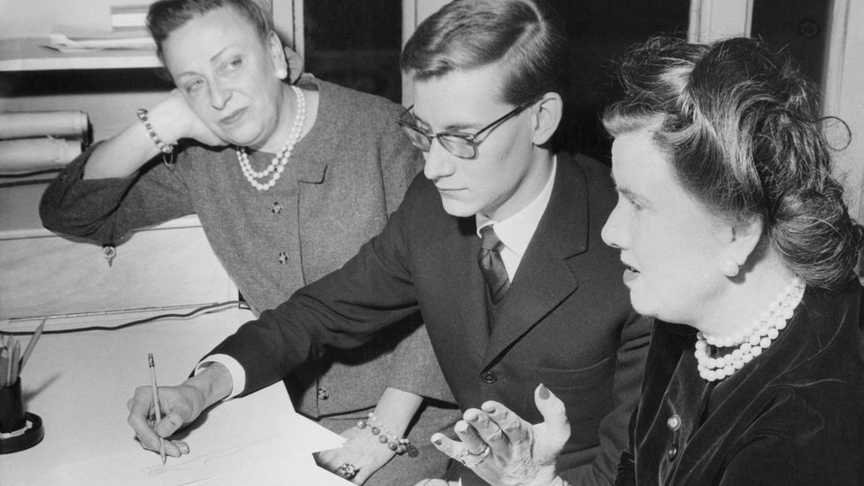 After Dior's death in 1957, Yves Saint Laurent took over with the support of Raymonde Zehnacker (left) and Marguerite Carré (right) (Credit: Getty Images)