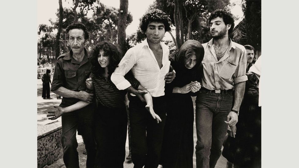 A Lebanese family leaving the Martyrs Cemetery, Beirut, 1976: McCullin makes sure he is close enough so that people know they’re being photographed, gaining unspoken permission