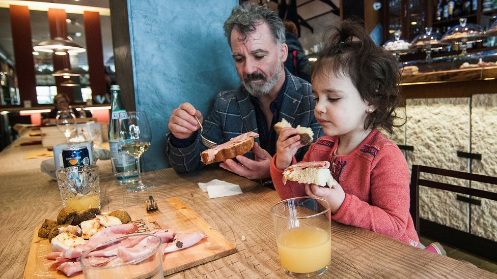 In Italy, families talk about whether the food is tasty (Credit: Getty)