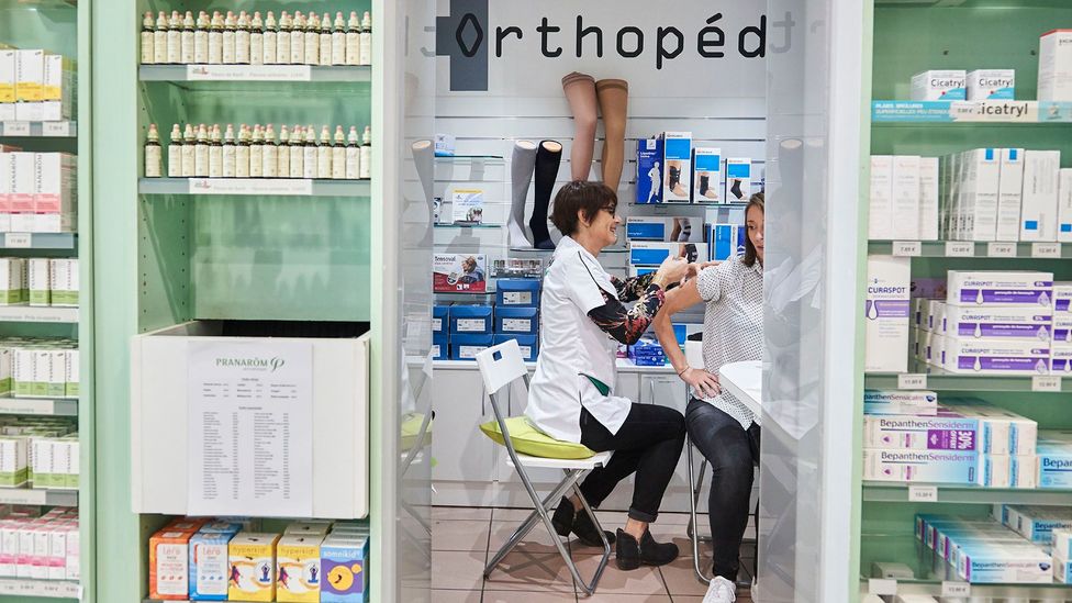 A woman receiving her seasonal flu vaccination at a pharmacy in 2017 (Credit: Getty Images)