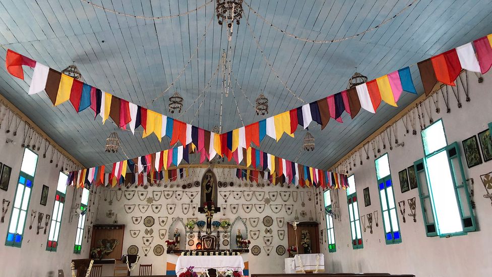 Tepoto's residents are predominantly Catholic and often attend mass in the island's one church every day. (Credit: Andrew Evans)