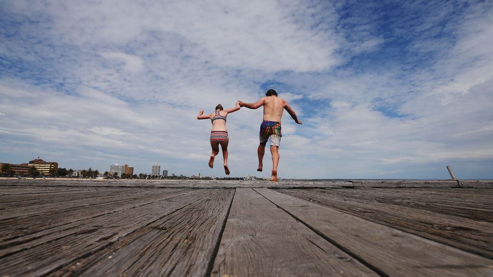 Father and daughter jump off the pier at South Melbourne Beach (Credit: Getty) Father and daughter jump off the pier at South Melbourne Beach (Credit: Getty)
