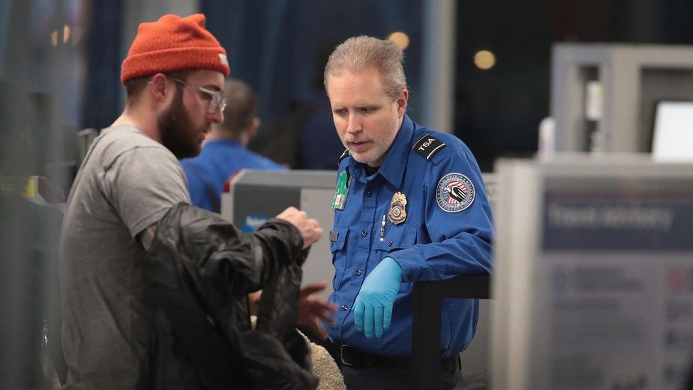 A Transportation Security Administration (TSA) worker screens passengers and airport employees at Chicago’s O'Hare International Airport (Credit: Getty Images) A Transportation Security Administration (TSA) worker screens passengers and airport employees at Chicago’s O'Hare International Airport (Credit: Getty Images)