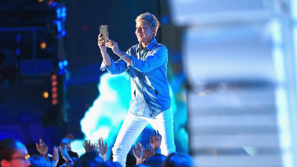 The famous presenter and CEO often opts for dance-friendly sneakers and bright button-downs (Credit: Getty Images) The famous presenter and CEO often opts for dance-friendly sneakers and bright button-downs (Credit: Getty Images)