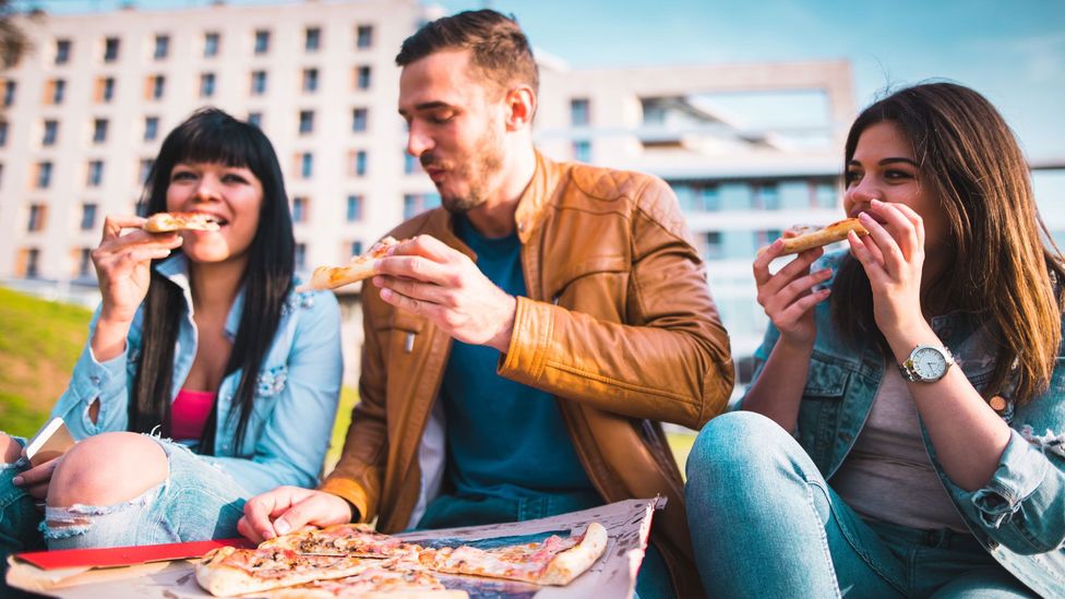 Below our conscious awareness, our friends can influence our eating habits and lifestyle (Credit: Getty Images)