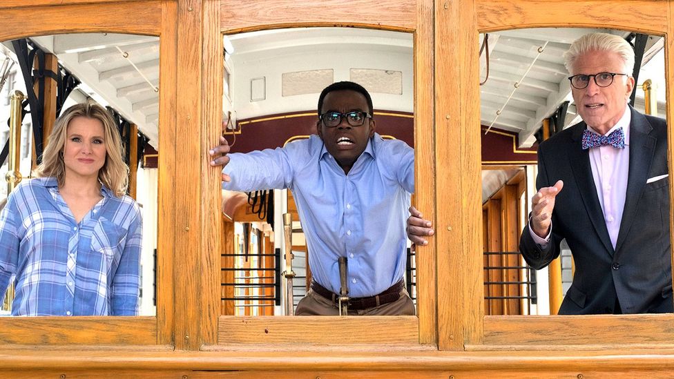 In The Good Place, Chidi is asked to test his response to the 'trolley problem' inside a real trolley on tracks (Credit: NBC)