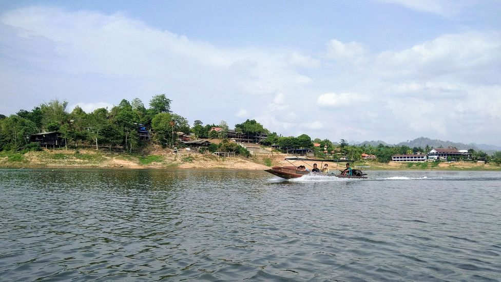 Boat on the Sangkalia River near Sangkhlaburi, Thailand Boat on the Sangkalia River near Sangkhlaburi, Thailand