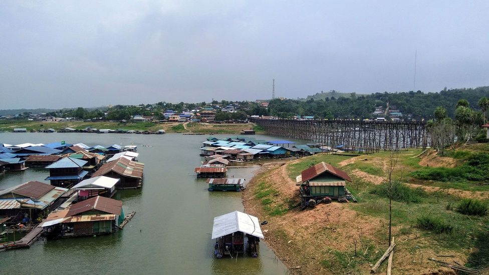 Houseboats on the Sangkalia River in Sangkhlaburi, Thailand Houseboats on the Sangkalia River in Sangkhlaburi, Thailand
