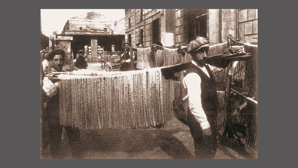 In the late 19th Century, pasta factories would slow-dry their pasta outside (Credit: Pastificio Di Martino) In the late 19th Century, pasta factories would slow-dry their pasta outside (Credit: Pastificio Di Martino)