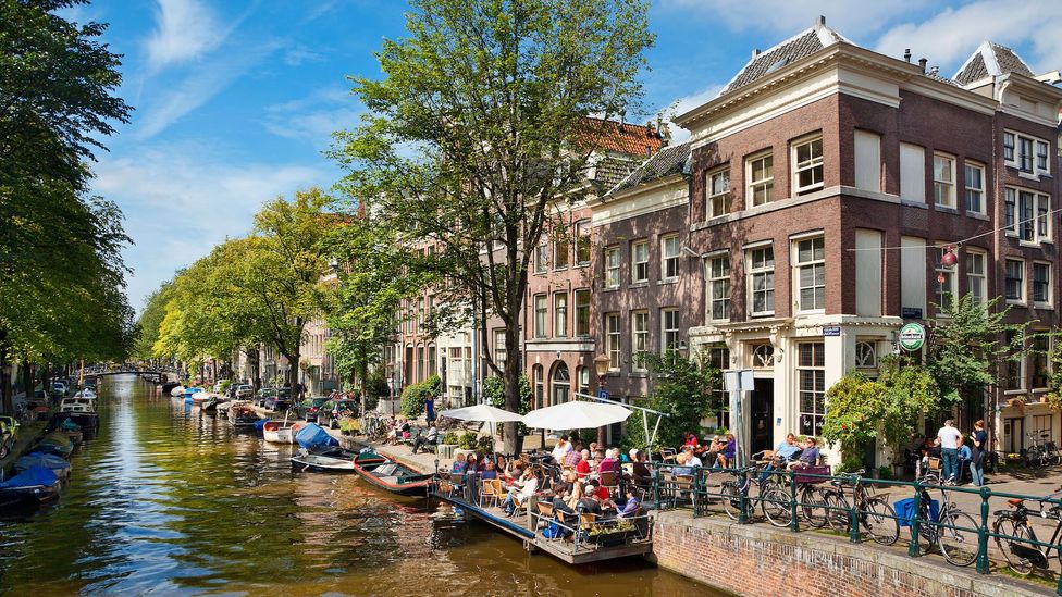 Fewer than one million people live in Amsterdam and 18 million people visited the city last year (Credit: John Kellerman/Alamy)