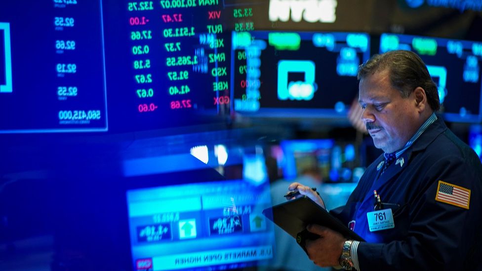 A man in the Wall Street stock exchange (Credit: Getty Images)