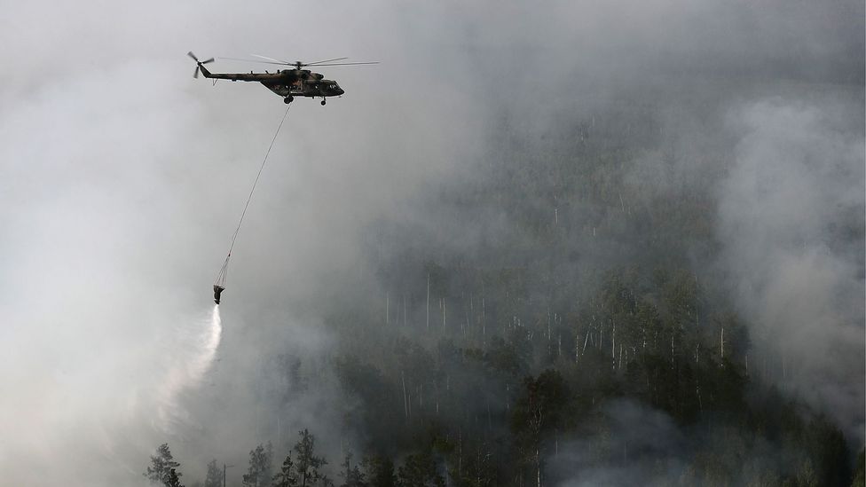 With over one million hectares of forest hit by fires in the Siberian tundra, they have been almost impossible to control them with firefighting (Credit: Getty Images) With over one million hectares of forest hit by fires in the Siberian tundra, they have been almost impossible to control them with firefighting (Credit: Getty Images)