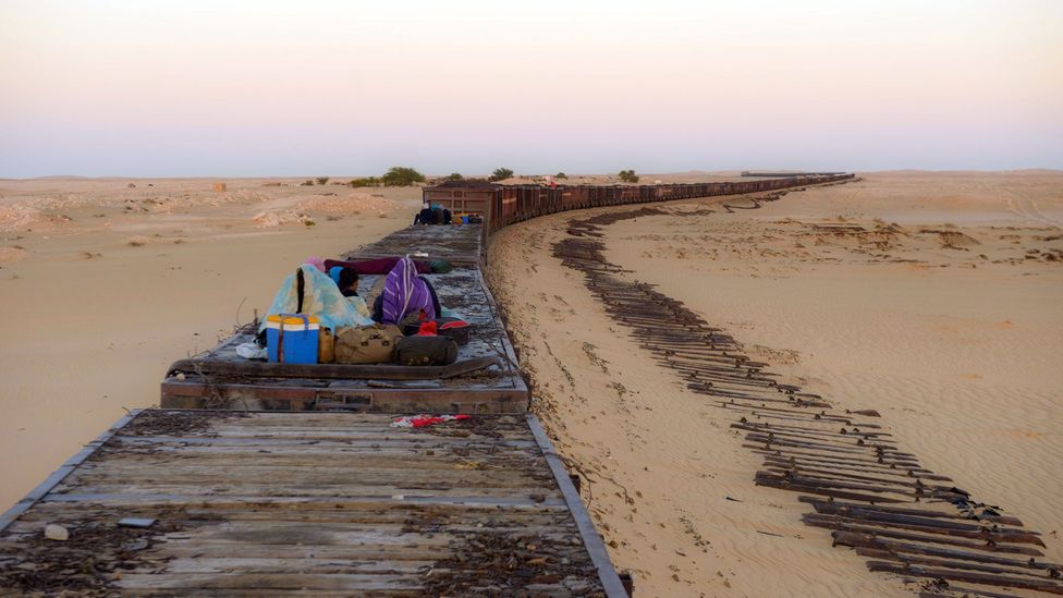 Many Mauritanians choose to ride in the freight cars free of charge (Credit: Novarc Images/Alamy)