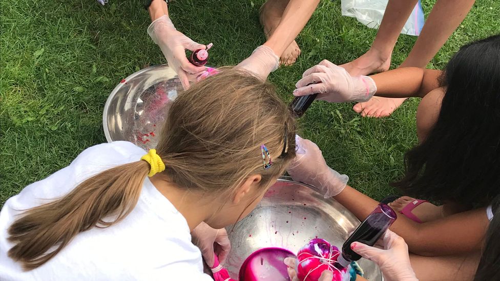 After a morning spent discussing the U.S.-China trade war the campers headed out into the sunshine to tie dye some t-shirts (Credit: Camp Millionaire)