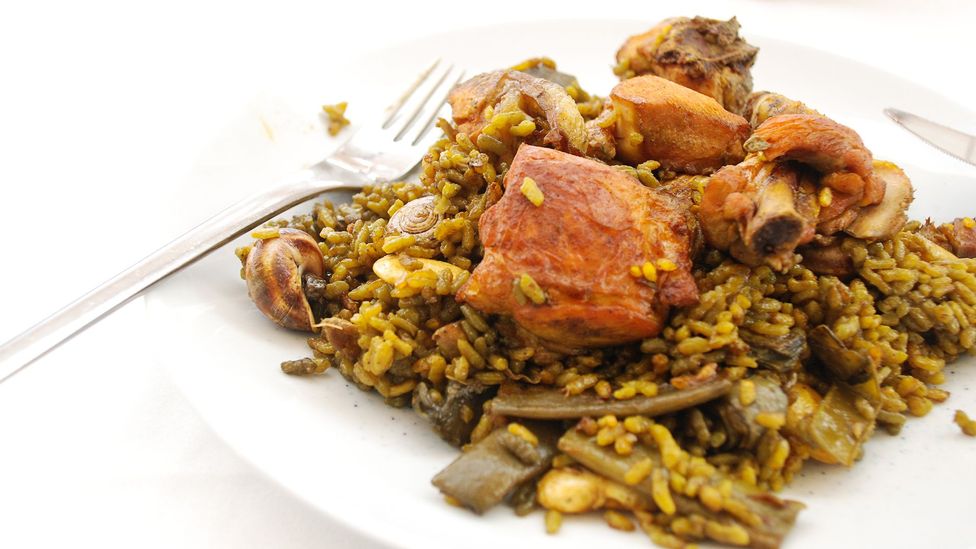 Though paella is often associated with seafood, traditional paella valenciana is made with meat, rice, snails and beans (Credit: Dan Convey)