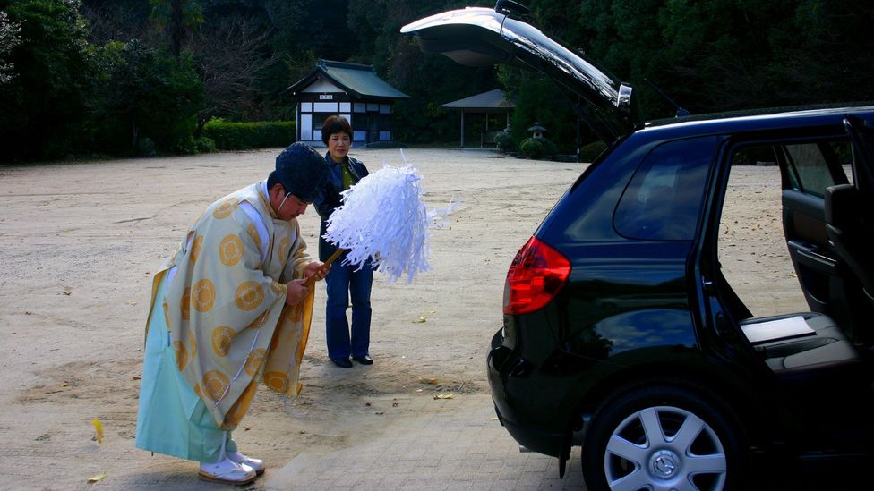 Many Japanese take their new car to a Shinto shrine to be purified by the priest (Credit: Angeles Marin Cabello) Many Japanese take their new car to a Shinto shrine to be purified by the priest (Credit: Angeles Marin Cabello)