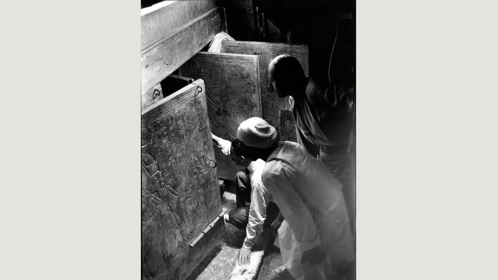 The excavation by Carter (here, kneeling in the burial chamber) was one of the most important archaeological finds of the 20th Century; many of the objects have yet to be studied