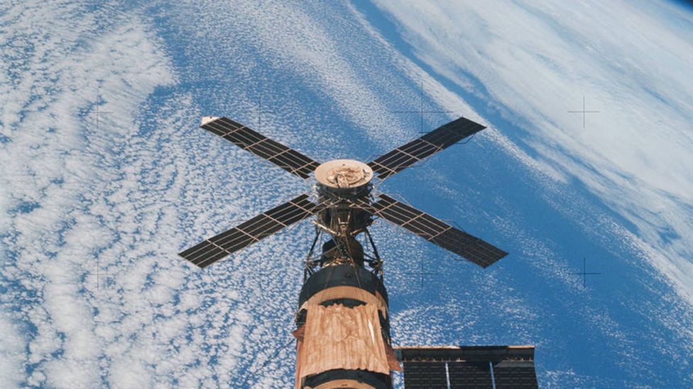 A solar array from the space station flies above Earth (Credit: Nasa)