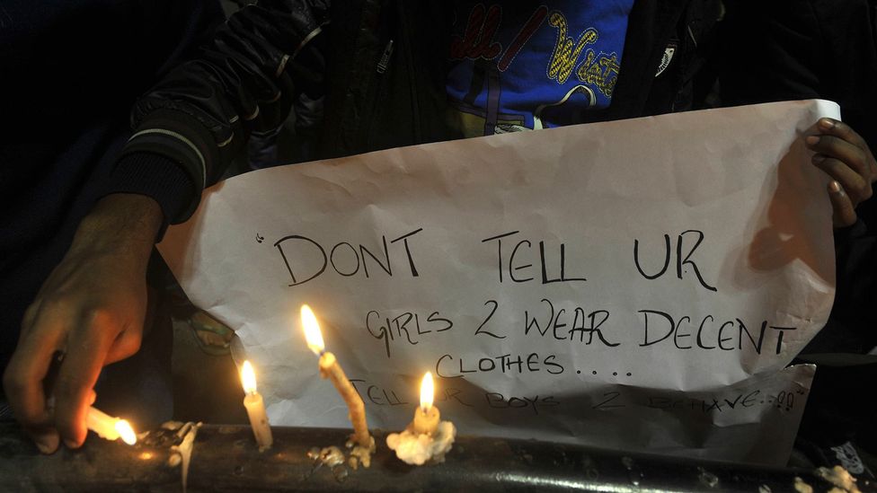 “Don’t tell your girls to wear decent clothes – tell your boys to behave,” reads a sign at a vigil for the victim of a brutal 2012 gangrape in New Delhi (Credit: Getty Images) “Don’t tell your girls to wear decent clothes – tell your boys to behave,” reads a sign at a vigil for the victim of a brutal 2012 gangrape in New Delhi (Credit: Getty Images)