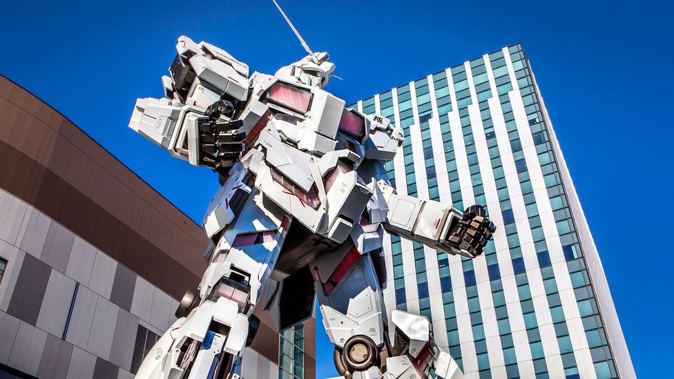 A giant Gundam robot towers over passers-by in the Odaiba district of Tokyo (credit: Prisma by Dukas/Getty Images)
