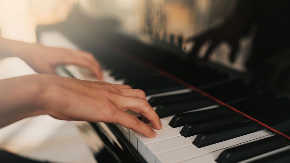 Americans are more likely to say ‘I play piano’, whereas a Brit would probably say ‘I play the piano’ (Credit: Alamy)