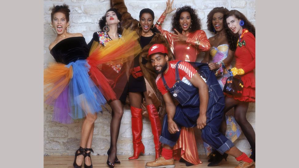 In the 1980s US designer Patrick Kelly, pictured here with models, wore dungarees to make a point about African-American history and identity (Credit: Getty Images)
