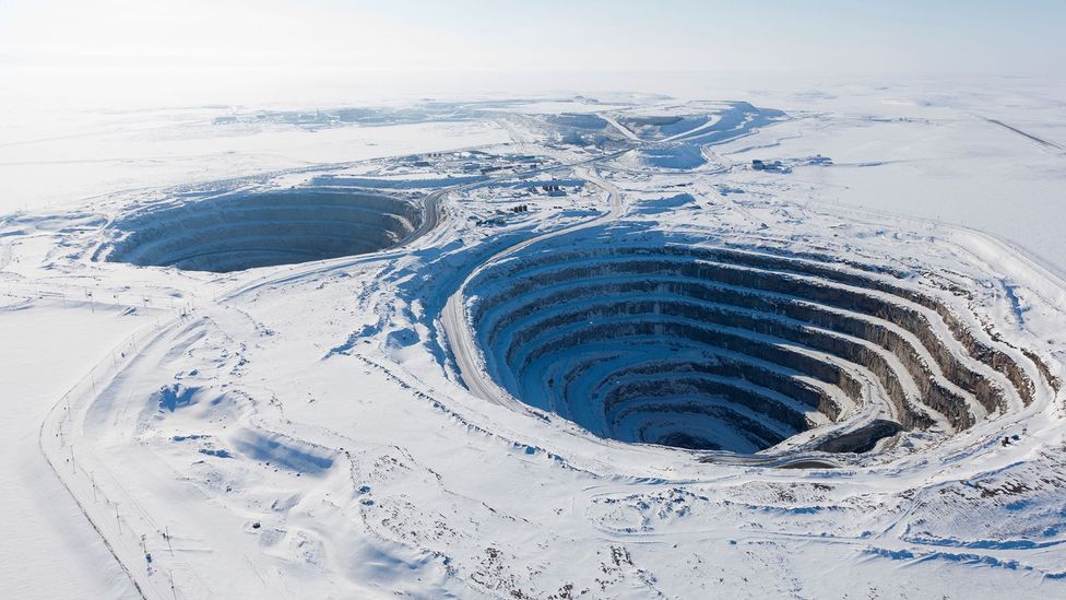 Diamond mining can involve the removal of vast amounts of earth and rock which creates holes so big they can be seen from space (Credit: Alamy)