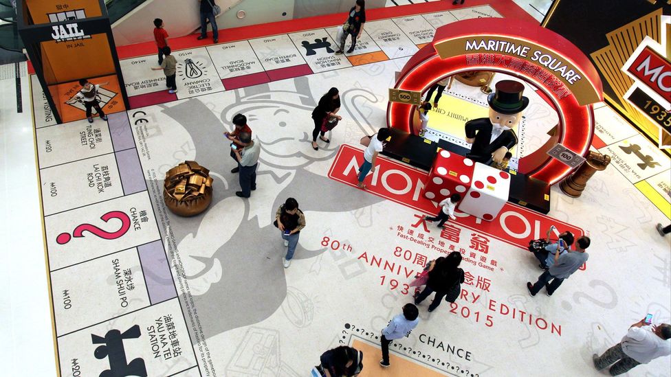 Shoppers in China walk over a giant version of the game which celebrates its 80th anniversary (Credit: Getty Images)