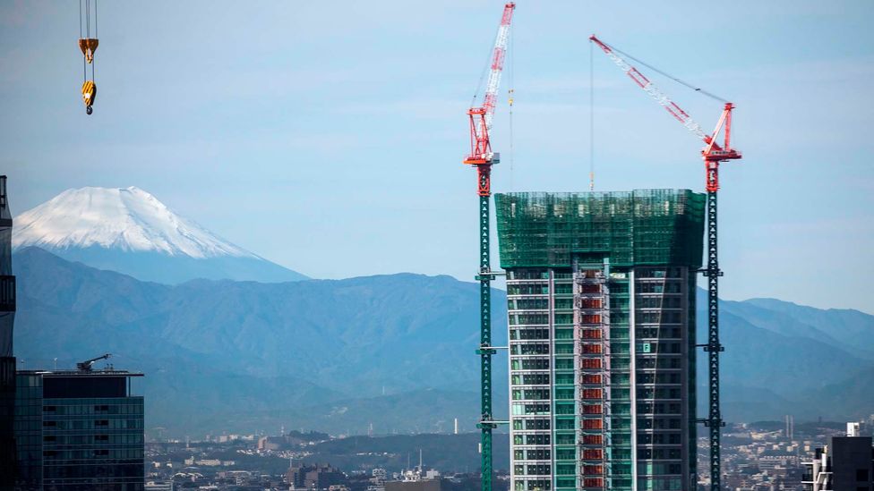 Construction in Tokyo has been booming thanks to playing host to major sporting event (Odd Anderson/AFP/Getty Images)