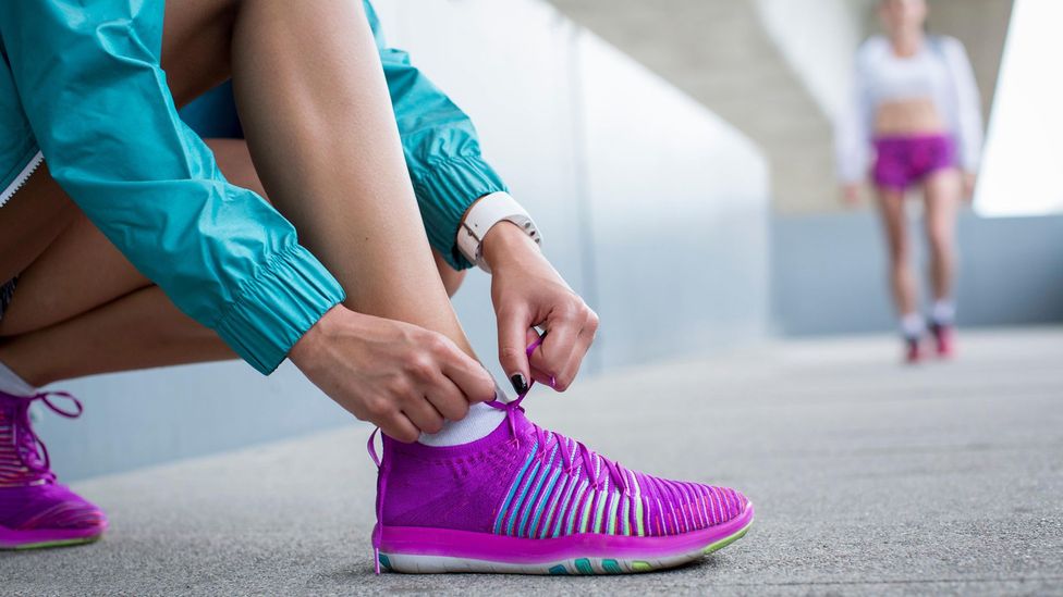 low-top trainers in leather with branded lace loop